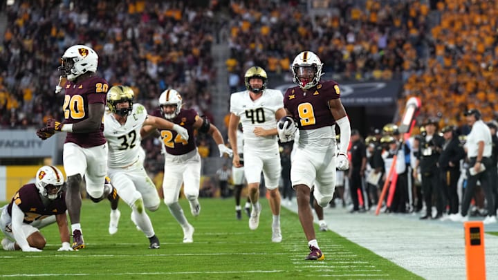 Arizona State Sun Devils defensive back Montana Warren (9) returns a blocked punt for a touchdown against the UCF Knights. Arizona State Sun Devils defensive back Montana Warren (9) returns a blocked punt for a touchdown against the UCF Knights.