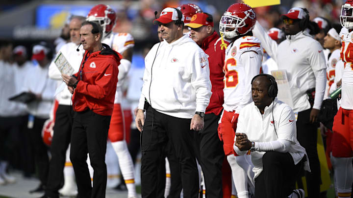 Jan 7, 2024; Inglewood, California, USA; Kansas City Chiefs defensive line coach Joe Cullen (center) looks on from the sideline alongside defensive coordinator Steve Spagnuolo (left) and defensive backs coach Dave Merritt (bottom, right) during the first half against the Los Angeles Chargers at SoFi Stadium. Mandatory Credit: Orlando Ramirez-Imagn Images