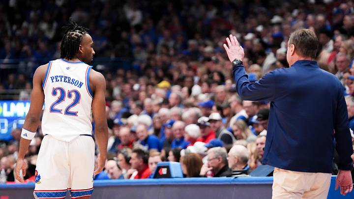 Feb 21, 2026; Lawrence, Kansas, USA; Kansas Jayhawks head coach Bill Self gestures to guard Darryn Peterson (22) against the Cincinnati Bearcats during the second half of the game at Allen Fieldhouse.