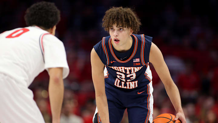 Dec 9, 2025; Columbus, Ohio, USA; Illinois Fighting Illini guard Keaton Wagler (23) handles the ball as Ohio State Buckeyes guard John Mobley Jr. (0) defends during the first halfat Value City Arena. Mandatory Credit: Joseph Maiorana-Imagn Images Dec 9, 2025; Columbus, Ohio, USA; Illinois Fighting Illini guard Keaton Wagler (23) handles the ball as Ohio State Buckeyes guard John Mobley Jr. (0) defends during the first halfat Value City Arena. Mandatory Credit: Joseph Maiorana-Imagn Images