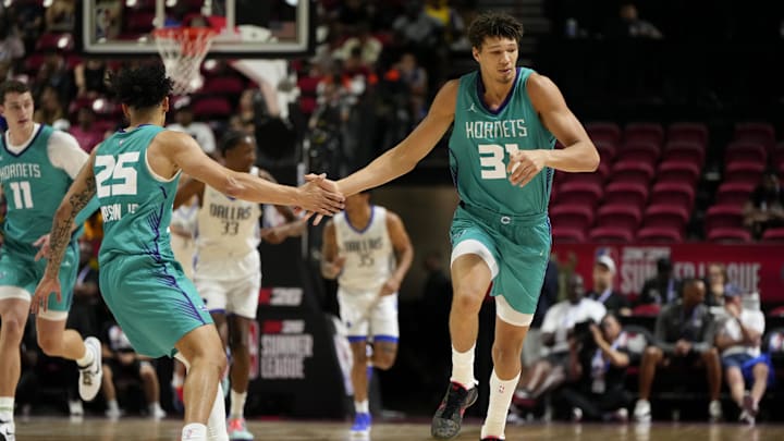 Jul 14, 2025; Las Vegas, NV, USA; Charlotte Hornets forward Tidjane Salaun (31) celebrates with guard KJ Simpson (25) after scoring against the Dallas Mavericks during the first half of a NBA basketball game at the Thomas & Mack Center. Mandatory Credit: Lucas Peltier-Imagn Images