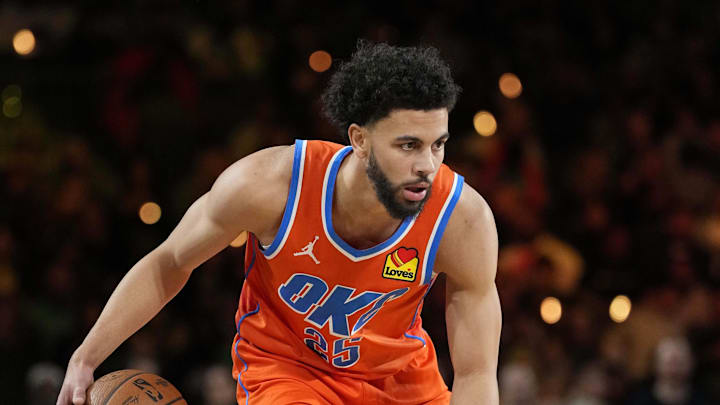 Dec 14, 2024; Las Vegas, Nevada, USA; Oklahoma City Thunder guard Ajay Mitchell (25) controls the ball against the Houston Rockets during the first half in a semifinal of the 2024 Emirates NBA Cup at T-Mobile Arena. Mandatory Credit: Kyle Terada-Imagn Images Dec 14, 2024; Las Vegas, Nevada, USA; Oklahoma City Thunder guard Ajay Mitchell (25) controls the ball against the Houston Rockets during the first half in a semifinal of the 2024 Emirates NBA Cup at T-Mobile Arena. Mandatory Credit: Kyle Terada-Imagn Images