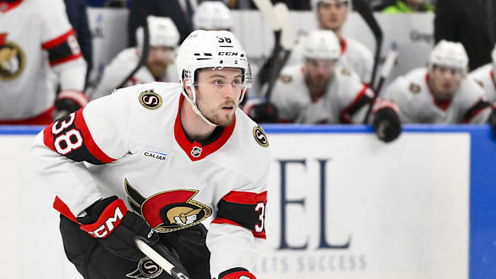 Jan 3, 2025; St. Louis, Missouri, USA;  Ottawa Senators center Zack Ostapchuk (38) controls the puck against the St. Louis Blues during the third period at Enterprise Center. Mandatory Credit: Jeff Curry-Imagn Images
