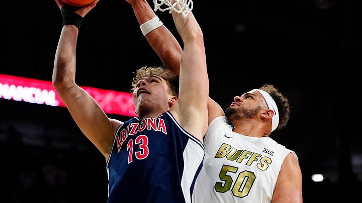 Mar 7, 2026; Boulder, Colorado, USA; Arizona Wildcats center Motiejus Krivas (13) shoots the ball over Colorado Buffaloes center Elijah Malone (50) in the first half at the CU Events Center Mar 7, 2026; Boulder, Colorado, USA; Arizona Wildcats center Motiejus Krivas (13) shoots the ball over Colorado Buffaloes center Elijah Malone (50) in the first half at the CU Events Center