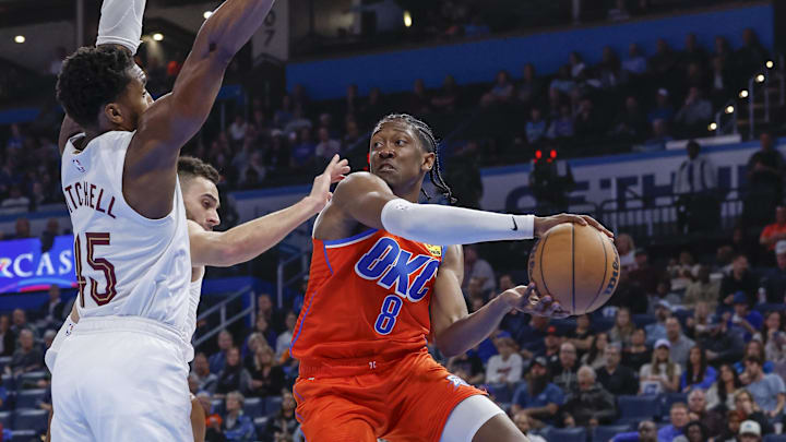 Nov 8, 2023; Oklahoma City, Oklahoma, USA; Oklahoma City Thunder forward Jalen Williams (8) passes the ball around Cleveland Cavaliers guard Donovan Mitchell (45) during the second half at Paycom Center. Oklahoma City won 128-120. Mandatory Credit: Alonzo Adams-Imagn Images Nov 8, 2023; Oklahoma City, Oklahoma, USA; Oklahoma City Thunder forward Jalen Williams (8) passes the ball around Cleveland Cavaliers guard Donovan Mitchell (45) during the second half at Paycom Center. Oklahoma City won 128-120. Mandatory Credit: Alonzo Adams-Imagn Images