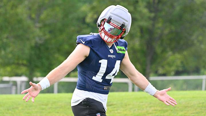 Jul 28, 2026; Foxborough, MA, USA; New England Patriots linebacker Robert Spillane (14) walks to practice for training camp at Gillette Stadium. Mandatory Credit: Eric Canha-Imagn Images