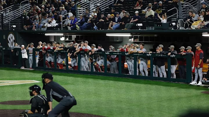 Alabama baseball players in the dugout. Alabama baseball players in the dugout.