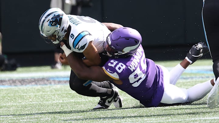 CHARLOTTE, NC - OCTOBER 01: Carolina Panthers quarterback Bryce Young (9) is sacked by Minnesota Vikings linebacker D.J. Wonnum (98) during an NFL football game between the Minnesota Vikings and the Carolina Panthers on October 1, 2023 at Bank of America Stadium in Charlotte, N.C. 