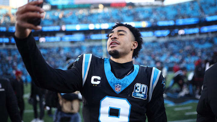 CHARLOTTE, NORTH CAROLINA - DECEMBER 22: Bryce Young #9 of the Carolina Panthers celebrates after defeating the Arizona Cardinals 36-30 at Bank of America Stadium on December 22, 2024 in Charlotte, North Carolina.