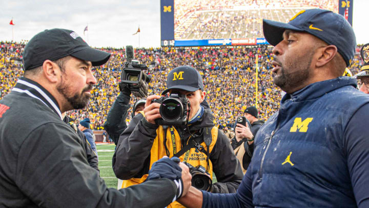 Michigan's Sherrone Moore and Ohio State's Ryan Day meet at mid-field