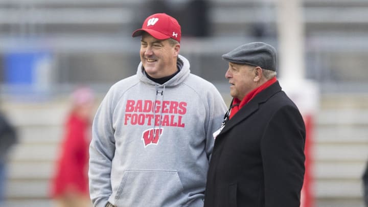 Nov 11, 2017; Madison, WI, USA; Wisconsin Badgers head coach Paul Chryst (left) talks with Wisconsin athletic director Barry Alvarez during warmups prior to a game against the Iowa Hawkeyes at Camp Randall Stadium.