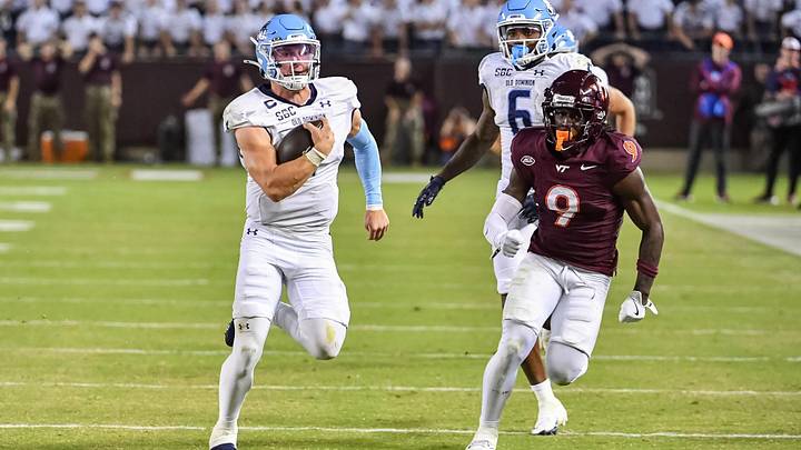 Sep 13, 2025; Blacksburg, Virginia, USA;  Old Dominion Monarchs quarterback Colton Joseph (1) runs the ball as Virginia Tech Hokies cornerback Isaiah Brown-Murray (9) pursues during the third quarter at Lane Stadium. Mandatory Credit: Brian Bishop-Imagn Images