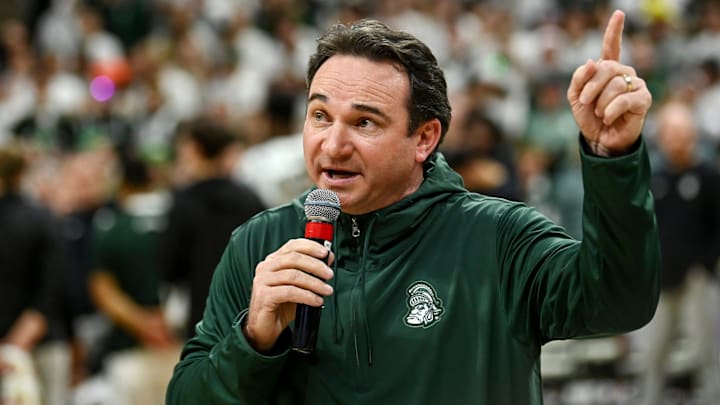 Michigan State's new football coach Jonathan Smith speaks to the crowd during a timeout in the