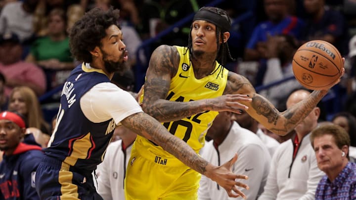 Oct 23, 2022; New Orleans, Louisiana, USA;  Utah Jazz guard Jordan Clarkson (00) looks to pass the ball against New Orleans Pelicans forward Brandon Ingram (14) during the first half at Smoothie King Center. Mandatory Credit: Stephen Lew-Imagn Images