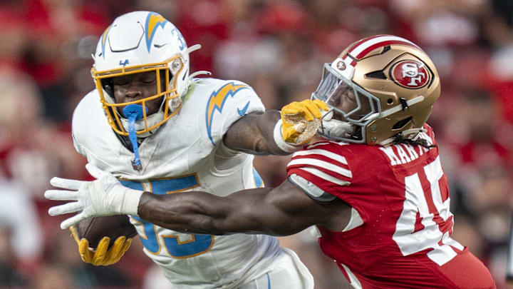 August 23, 2025; Santa Clara, California, USA; Los Angeles Chargers running back Raheim Sanders (35) runs the football against San Francisco 49ers linebacker Nick Martin (45) during the third quarter at Levi's Stadium. Mandatory Credit: Kyle Terada-Imagn Images