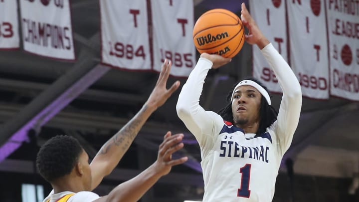 Stepinac's Boogie Fland puts up a shot against Nazareth during the CHSAA city championship. Stepinac's Boogie Fland puts up a shot against Nazareth during the CHSAA city championship.