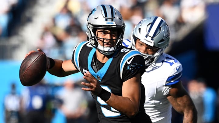 Nov 19, 2023; Charlotte, North Carolina, USA; Carolina Panthers quarterback Bryce Young (9) looks to.pass as Dallas Cowboys linebacker Micah Parsons (11) pressures in the second quarter at Bank of America Stadium. Mandatory Credit: Bob Donnan-Imagn Images Nov 19, 2023; Charlotte, North Carolina, USA; Carolina Panthers quarterback Bryce Young (9) looks to.pass as Dallas Cowboys linebacker Micah Parsons (11) pressures in the second quarter at Bank of America Stadium. Mandatory Credit: Bob Donnan-Imagn Images