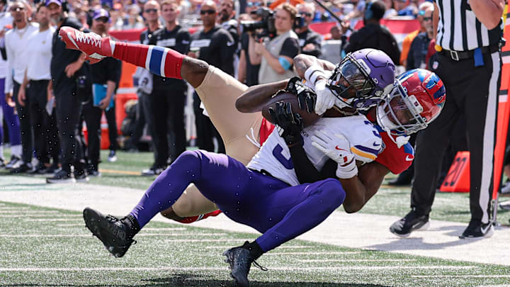 Sep 8, 2024; East Rutherford, New Jersey, USA; Minnesota Vikings wide receiver Jordan Addison (3) is tackled by New York Giants cornerback Dru Phillips (22) during the first half at MetLife Stadium. Sep 8, 2024; East Rutherford, New Jersey, USA; Minnesota Vikings wide receiver Jordan Addison (3) is tackled by New York Giants cornerback Dru Phillips (22) during the first half at MetLife Stadium.