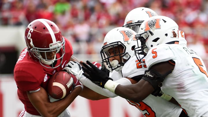 Nov 18, 2017; Tuscaloosa, AL, USA; Alabama Crimson Tide wide receiver DeVonta Smith (6) carries the ball against Mercer Bears defensive backs Brandon Gurley (29) and Malique Fleming (5) during the third quarter at Bryant-Denny Stadium. 