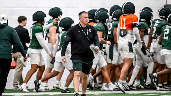 Michigan State's head coach Pat Fitzgerald works with the team during spring football practice on Tuesday, March 24, 2026, in East Lansing.