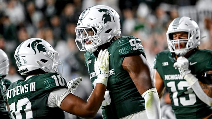 Michigan State's Jalen Thompson, right, celebrates his tackle for a safety against Western Michigan during the third quarter on Friday, Aug. 29, 2025, in East Lansing.