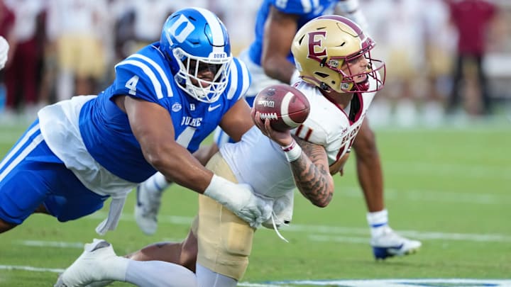Aug 28, 2025; Durham, North Carolina, USA;  Duke Blue Devils defensive tackle Josiah Green (4) sacks Elon Phoenix quarterback Landen Clark (11) during the first half at Wallace Wade Stadium.