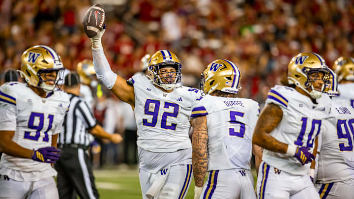 Bryce Butler holds up the Huskies' first fumble recovery of the season from the Apple Cup.