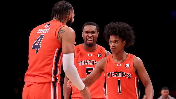 Nov 16, 2023; Brooklyn, New York, USA; Auburn Tigers forward Johni Broome (4) celebrates with