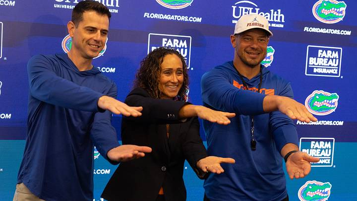 Head basketball coach Todd Golden, new Womens basketball head coach Tammi Reiss, and Florida head football coach Jon Sumrall pose for a photo during a press conference after spring practice at Sanders Practice Fields in Gainesville, FL on Tuesday, March 24, 2026. [Alan Youngblood/Gainesville Sun]