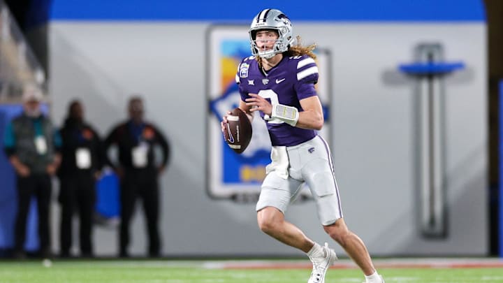 Dec 28, 2023; Orlando, FL, USA;  Kansas State Wildcats quarterback Avery Johnson (2) drops back to pass against the North Carolina State Wolfpack in the first quarter during the Pop-Tarts Bowl at Camping World Stadium. Mandatory Credit: Nathan Ray Seebeck-USA TODAY Sports