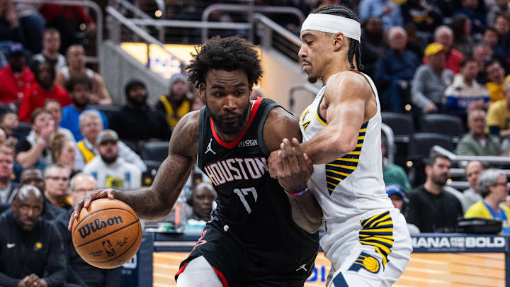 Mar 4, 2025; Indianapolis, Indiana, USA; Houston Rockets forward Tari Eason (17) dribbles the ball while Indiana Pacers guard Andrew Nembhard (2) defends in the first half at Gainbridge Fieldhouse. Mandatory Credit: Trevor Ruszkowski-Imagn Images