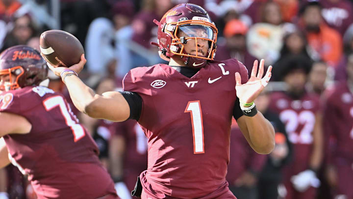Nov 1, 2025; Blacksburg, Virginia, USA;  Virginia Tech Hokies quarterback Kyron Drones (1) throws a pass against the Louisville Cardinals at Lane Stadium. Mandatory Credit: Brian Bishop-Imagn Images