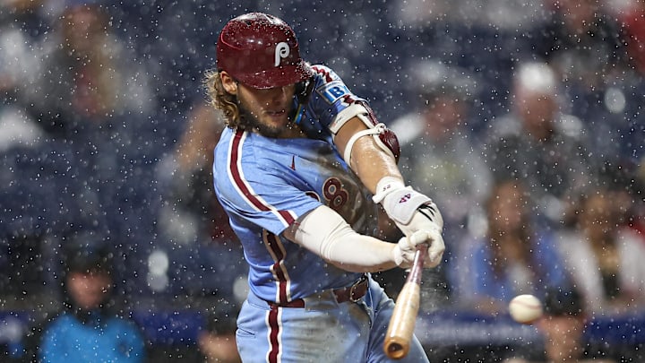 Philadelphia Phillies third base Alec Bohm (28) hits a single against the Miami Marlins during the eighth inning at Citizens Bank Park. 