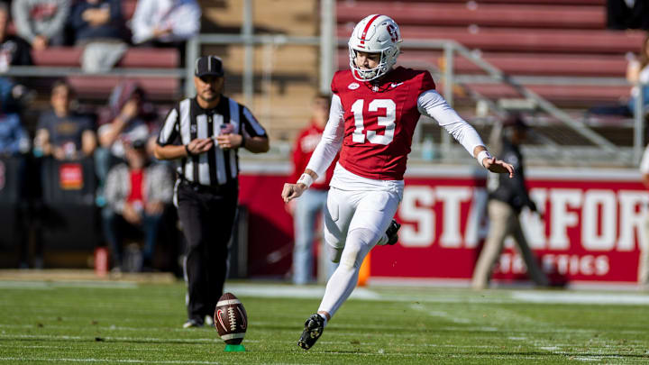 Nov 16, 2024; Stanford, California, USA;  Stanford Cardinal place kicker Emmet Kenney (13) kicks off during the first quarter against the Louisville Cardinals at Stanford Stadium. Mandatory Credit: Bob Kupbens-Imagn Images
