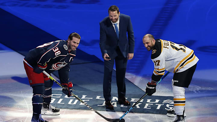 Blue Jackets captain Boone Jenner takes a ceremonial first puck drop from former captain Rick Nash, against former captain Nick Foligno. All franchise legends in Columbus.