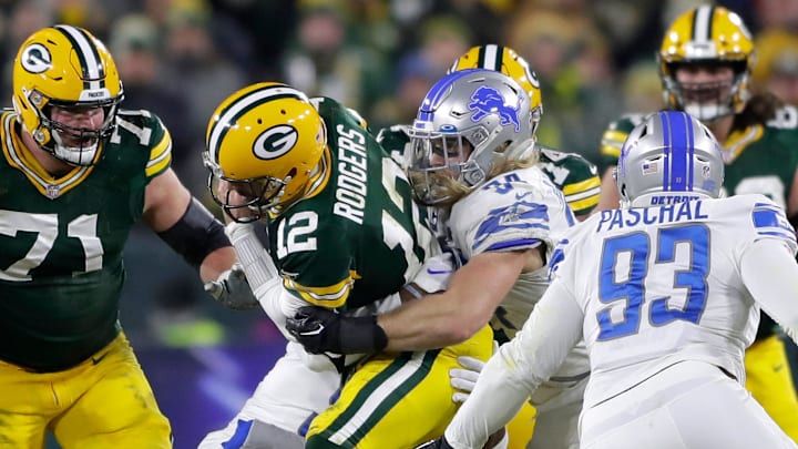 Detroit Lions linebacker Alex Anzalone (34) sacks Green Bay Packers quarterback Aaron Rodgers (12).
