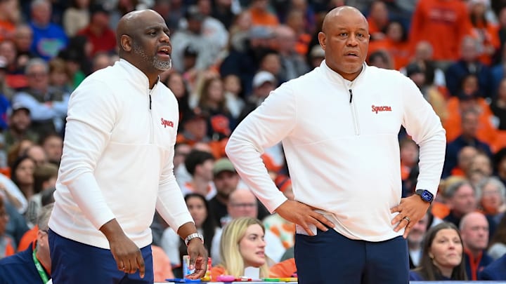 Jan 24, 2026; Syracuse, New York, USA; Syracuse Orange assistant coach Allen Griffin (left) and head coach Adrian Autry (right) look on during the first half against the Miami Hurricanes at the JMA Wireless Dome. Mandatory Credit: Rich Barnes-Imagn Images