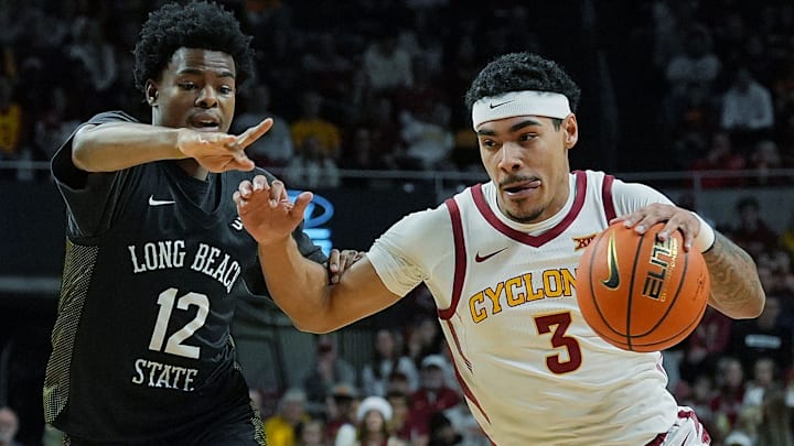 Iowa State Cyclones guard Tamin Lipsey (3) drives with the ball around Long Beach State guard Isaiah Lewis (12) during the first half in the NCAA men’s basketball on Dec. 21, 2025, at Hilton Coliseum in Ames, Iowa.