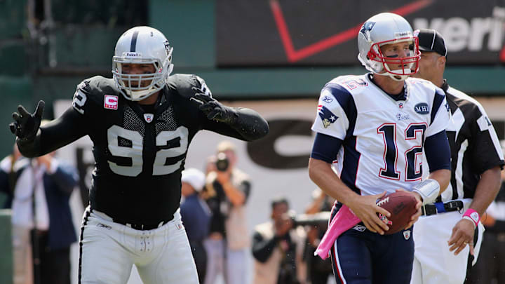 Oct 2, 2011; Oakland, CA, USA; Oakland Raiders defensive end Richard Seymour (92) reacts after being called for a personal foul against New England Patriots quarterback Tom Brady (12) in the first quarter at O.co Coliseum. Mandatory Credit: Cary Edmondson-Imagn Images