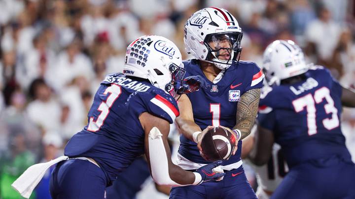 Oct 3, 2026; Tucson, Arizona, USA;  Arizona Wildcats quarterback Noah Fifita (1) hands the ball off during the second quarter of the game against the Cincinnati Bearcats at Casino Del Sol Stadium.