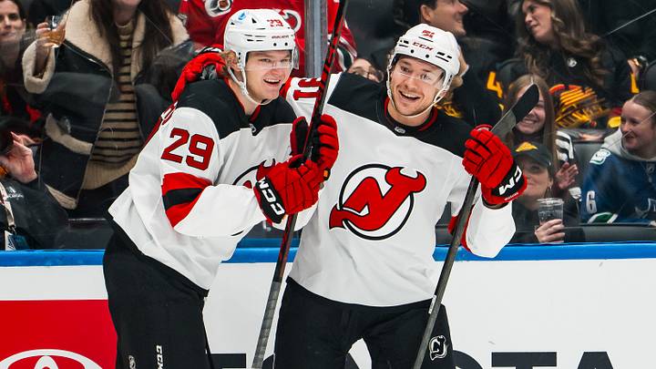 New Jersey Devils forward Lenni Hameenaho (29) and forward Arseny Gritsyuk (81) celebrate Hameenaho’s first NHL goal against the Vancouver Canucks in the first period at Rogers Arena. Mandatory Credit: Bob Frid-Imagn Images