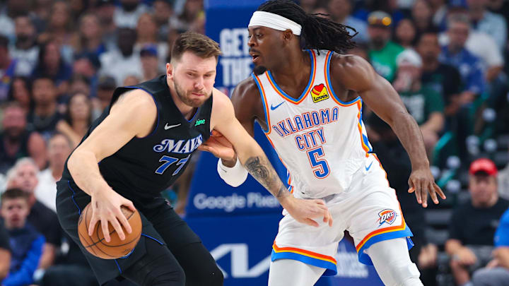 May 18, 2024; Dallas, Texas, USA; Dallas Mavericks guard Luka Doncic (77) controls the ball as Oklahoma City Thunder guard Luguentz Dort (5) defends during the first quarter in game six of the second round of the 2024 NBA playoffs at American Airlines Center. Mandatory Credit: Kevin Jairaj-Imagn Images May 18, 2024; Dallas, Texas, USA; Dallas Mavericks guard Luka Doncic (77) controls the ball as Oklahoma City Thunder guard Luguentz Dort (5) defends during the first quarter in game six of the second round of the 2024 NBA playoffs at American Airlines Center. Mandatory Credit: Kevin Jairaj-Imagn Images