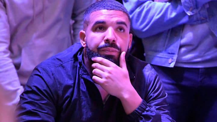 Recording artist Drake watches with Toronto Raptors fans as they cheer on their team in the NBA Finals against Golden State Warriors at the Jurassic Park watch party at Scotiabank Arena