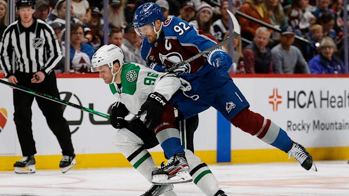 Apr 23, 2025; Denver, Colorado, USA; Colorado Avalanche left wing Gabriel Landeskog (92) checks Dallas Stars right wing Mikko Rantanen (96) in the first period in game three of the first round of the 2025 Stanley Cup Playoffs at Ball Arena. Mandatory Credit: Isaiah J. Downing-Imagn Images