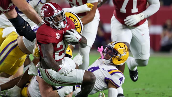 Nov 8, 2025; Tuscaloosa, Alabama, USA; Alabama Crimson Tide running back Jamarion Miller (26) is tackles by Louisiana State Tigers during the first quarter of the game at Saban Field at Bryant-Denny Stadium. Mandatory Credit: David Leong-Imagn Images
