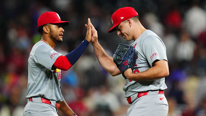 Sep 25, 2024; Denver, Colorado, USA; St. Louis Cardinals second base Jose Fermin (15) and relief pitcher Ryan Helsley (56) celebrate defeating the Colorado Rockies at Coors Field. Mandatory Credit: Ron Chenoy-Imagn Images Sep 25, 2024; Denver, Colorado, USA; St. Louis Cardinals second base Jose Fermin (15) and relief pitcher Ryan Helsley (56) celebrate defeating the Colorado Rockies at Coors Field. Mandatory Credit: Ron Chenoy-Imagn Images