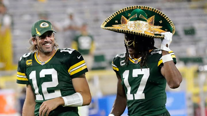 Green Bay Packers quarterback Aaron Rodgers (12) laughs as wide receiver Davante Adams (17) dons a sombrero as the two exit the field after defeating the Detroit Lions during their football game Monday, September 20, 2021, at Lambeau Field in Green Bay, Wis. 