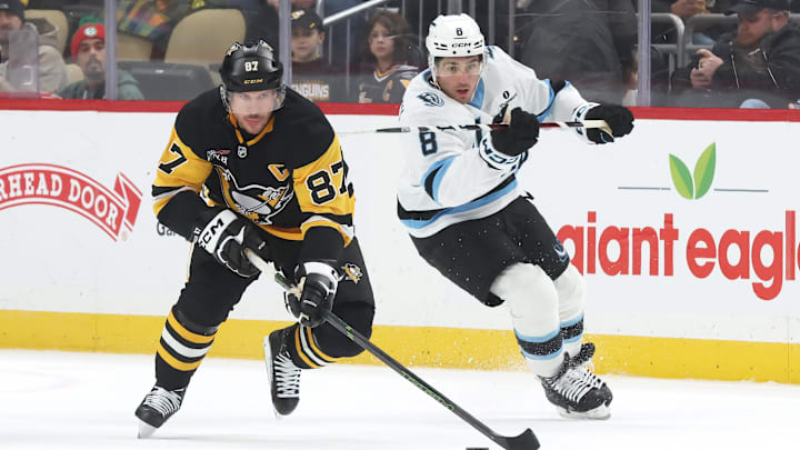Dec 14, 2025; Pittsburgh, Pennsylvania, USA; Pittsburgh Penguins center Sidney Crosby (87) skates up ice with the puck as Utah Mammoth center Nick Schmaltz (8) chases during the first period at PPG Paints Arena. Mandatory Credit: Charles LeClaire-Imagn Images Dec 14, 2025; Pittsburgh, Pennsylvania, USA; Pittsburgh Penguins center Sidney Crosby (87) skates up ice with the puck as Utah Mammoth center Nick Schmaltz (8) chases during the first period at PPG Paints Arena. Mandatory Credit: Charles LeClaire-Imagn Images