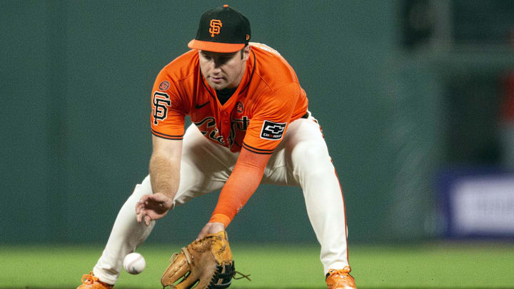 Sep 27, 2024; San Francisco, California, USA; San Francisco Giants designated hitter Casey Schmitt (10) fields a ground ball by St. Louis Cardinals designated hitter Matt Carpenter during the seventh inning at Oracle Park.