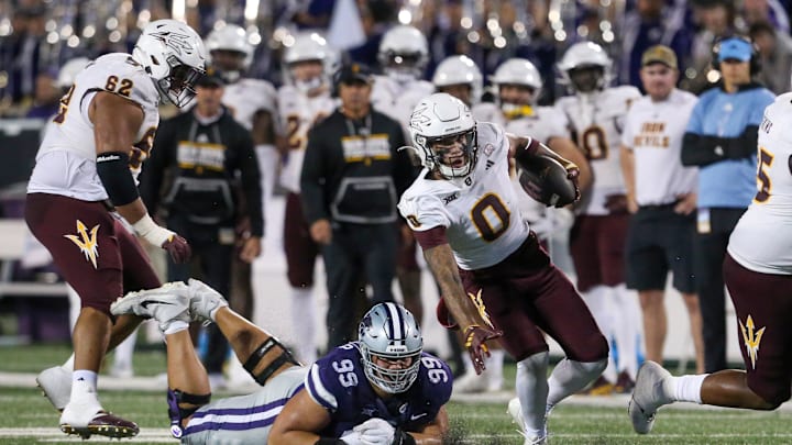 Nov 16, 2024; Manhattan, Kansas, USA; Arizona State Sun Devils wide receiver Jordyn Tyson (0) breaks away from Kansas State Wildcats defensive tackle George Traglia (95) during the third quarter at Bill Snyder Family Football Stadium. Mandatory Credit: Scott Sewell-Imagn Images